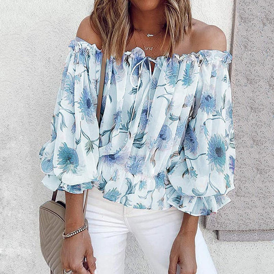 Blus med blommig ruffle ärm